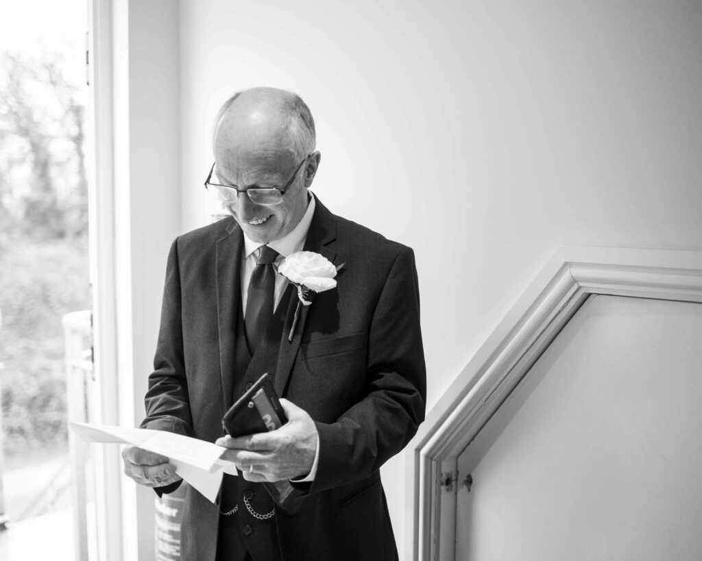 Father of the bride reading speech before the Sandy Cove Hotel wedding
