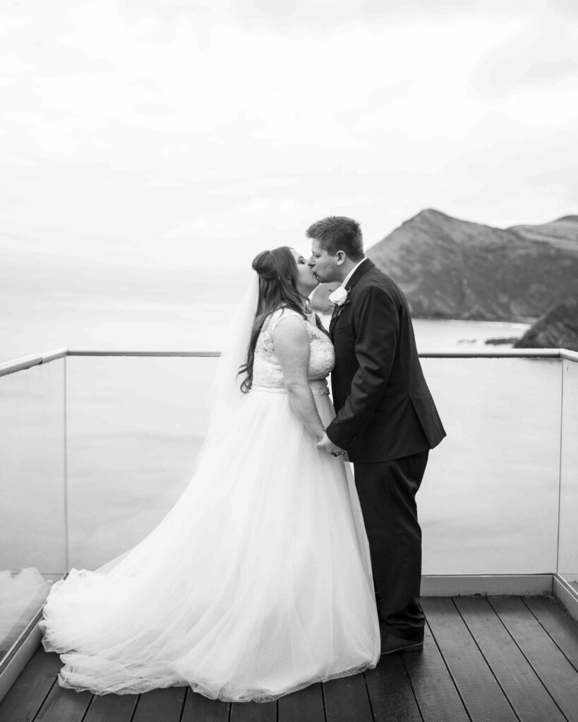 Black and white image of Sam and Lisa at their Sandy Cove Hotel wedding