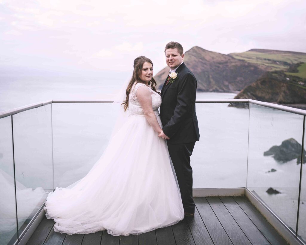 Landscape image of the couple at the Sandy Cove Hotel wedding